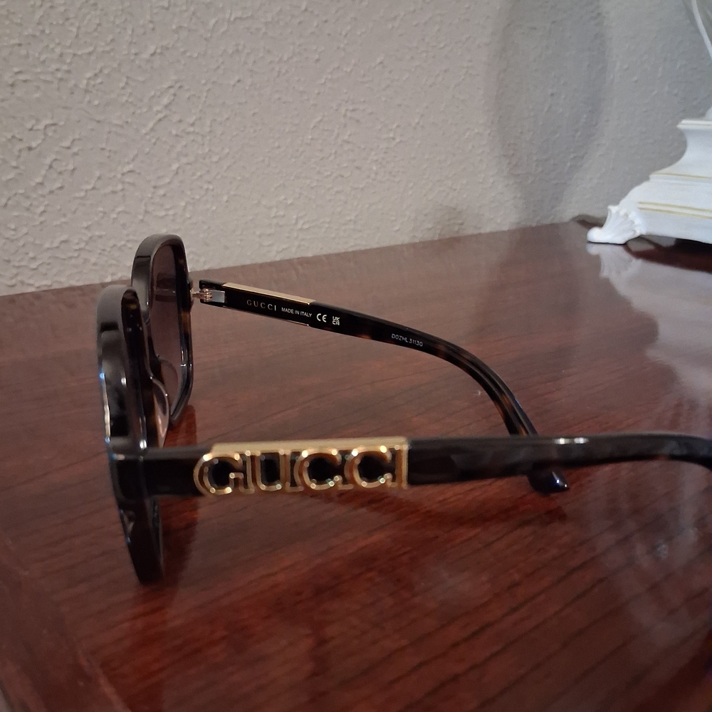 Gucci Black Sunglasses with Gold Detailing